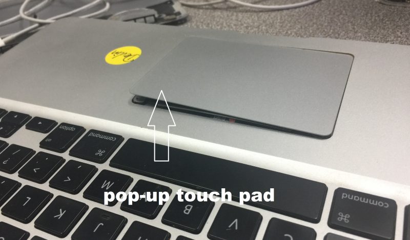 track pad pops up from a MacBook top case